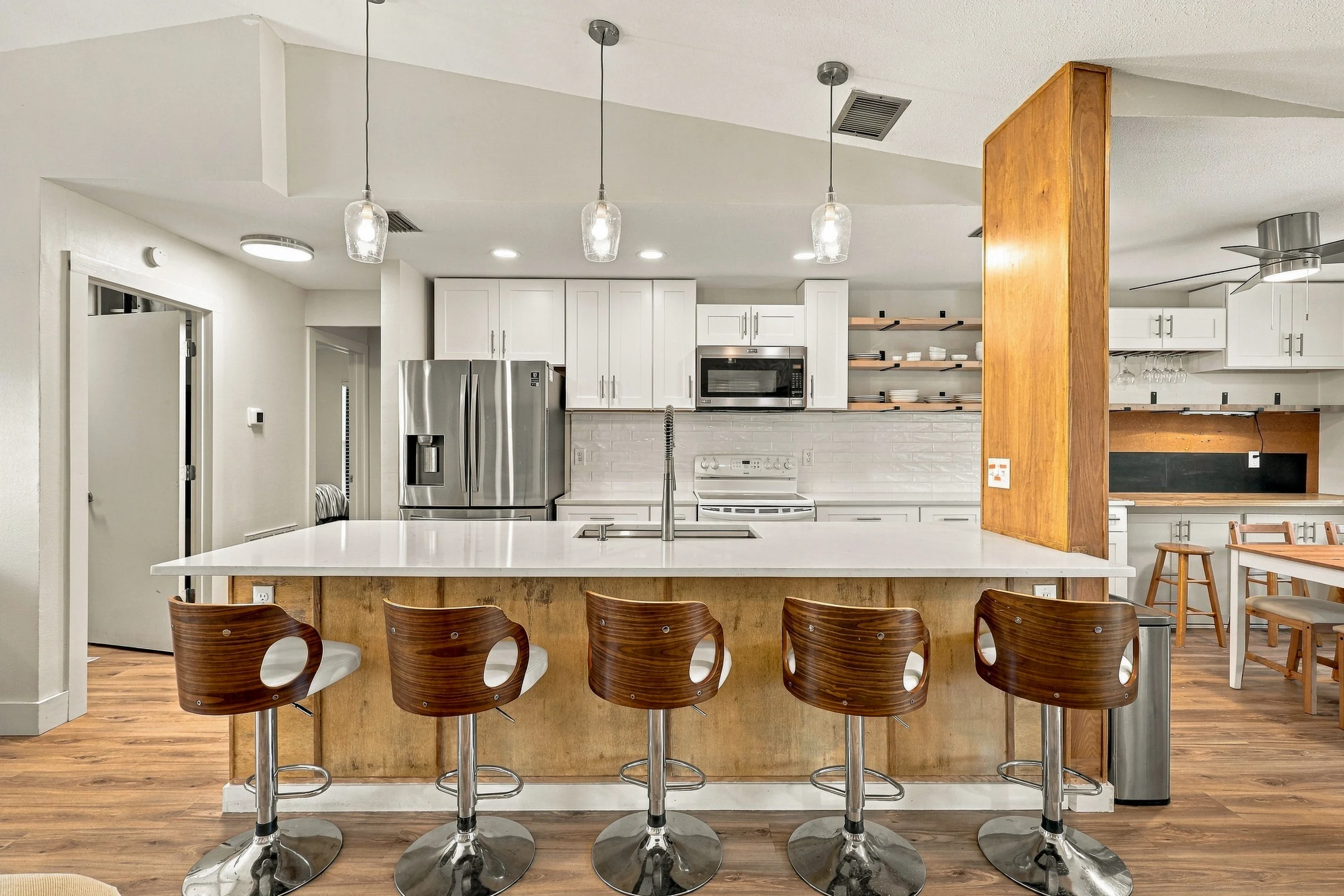 Bright kitchen with wood accents photographed by Vuzario