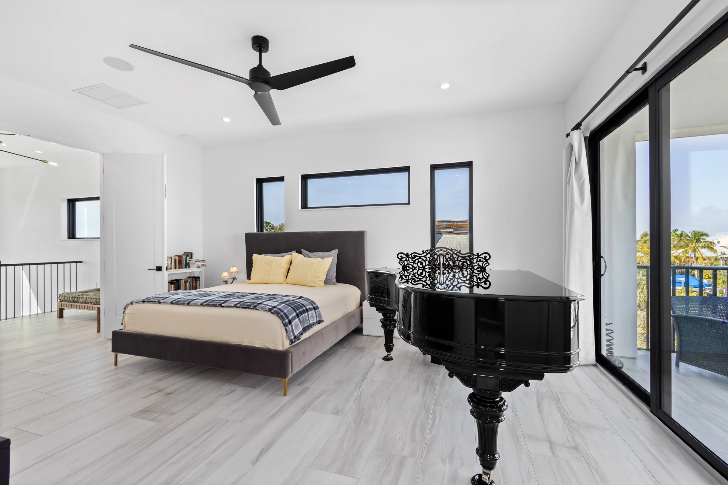 Airy modern bedroom and sitting area photographed by Vuzario