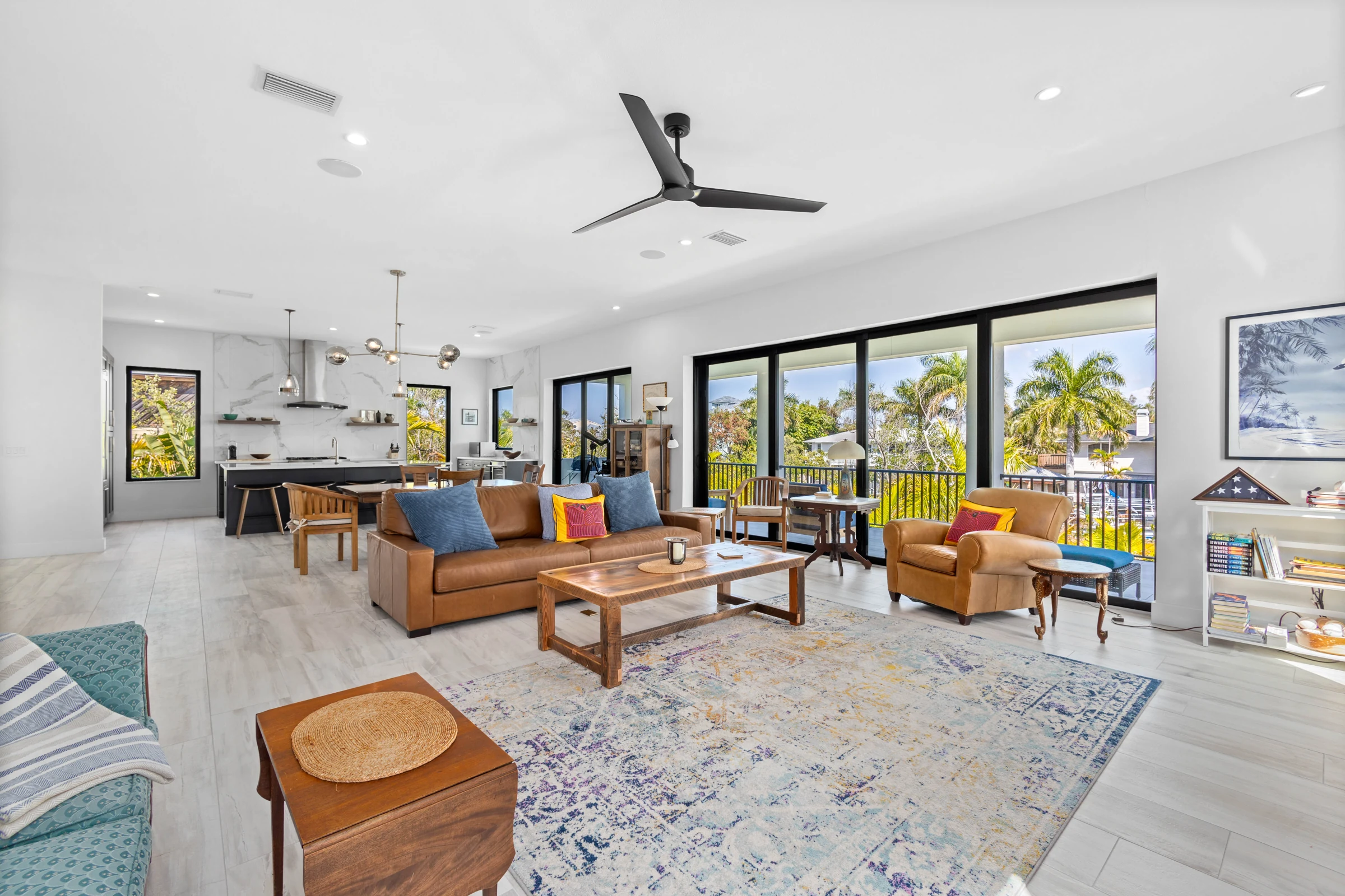 Open living space with tropical views photographed by Vuzario