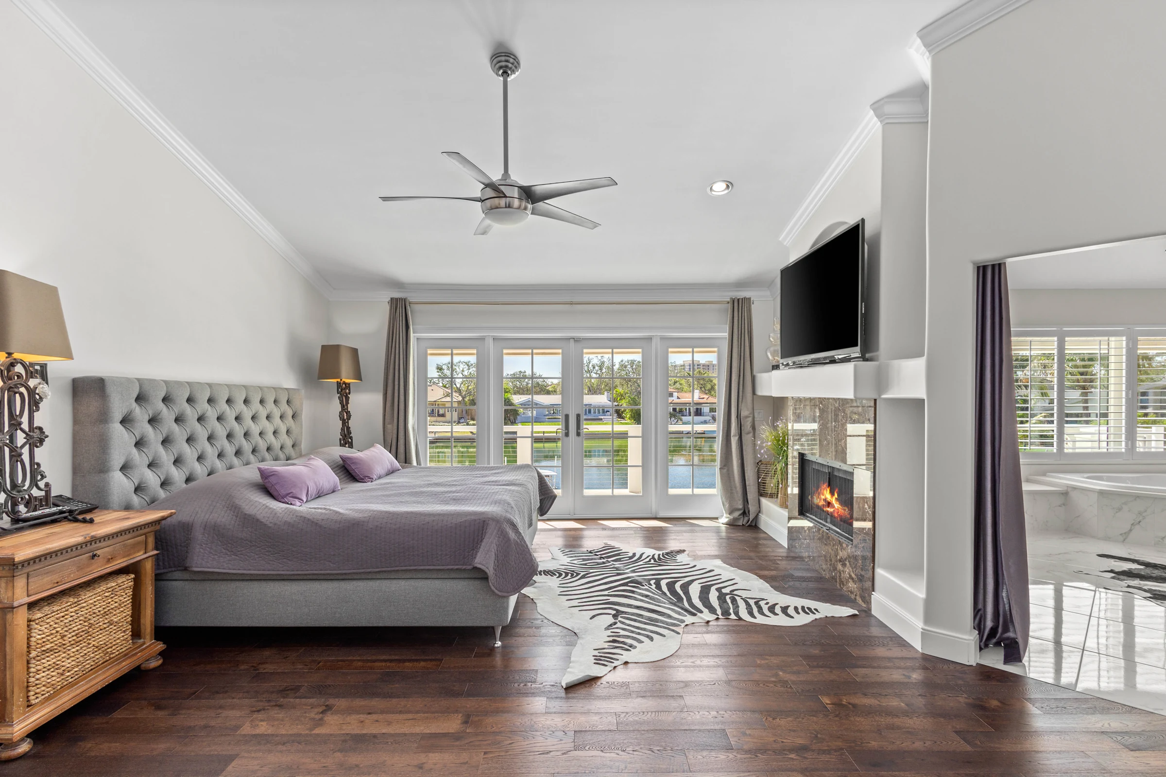 Waterfront primary bedroom photographed by Vuzario