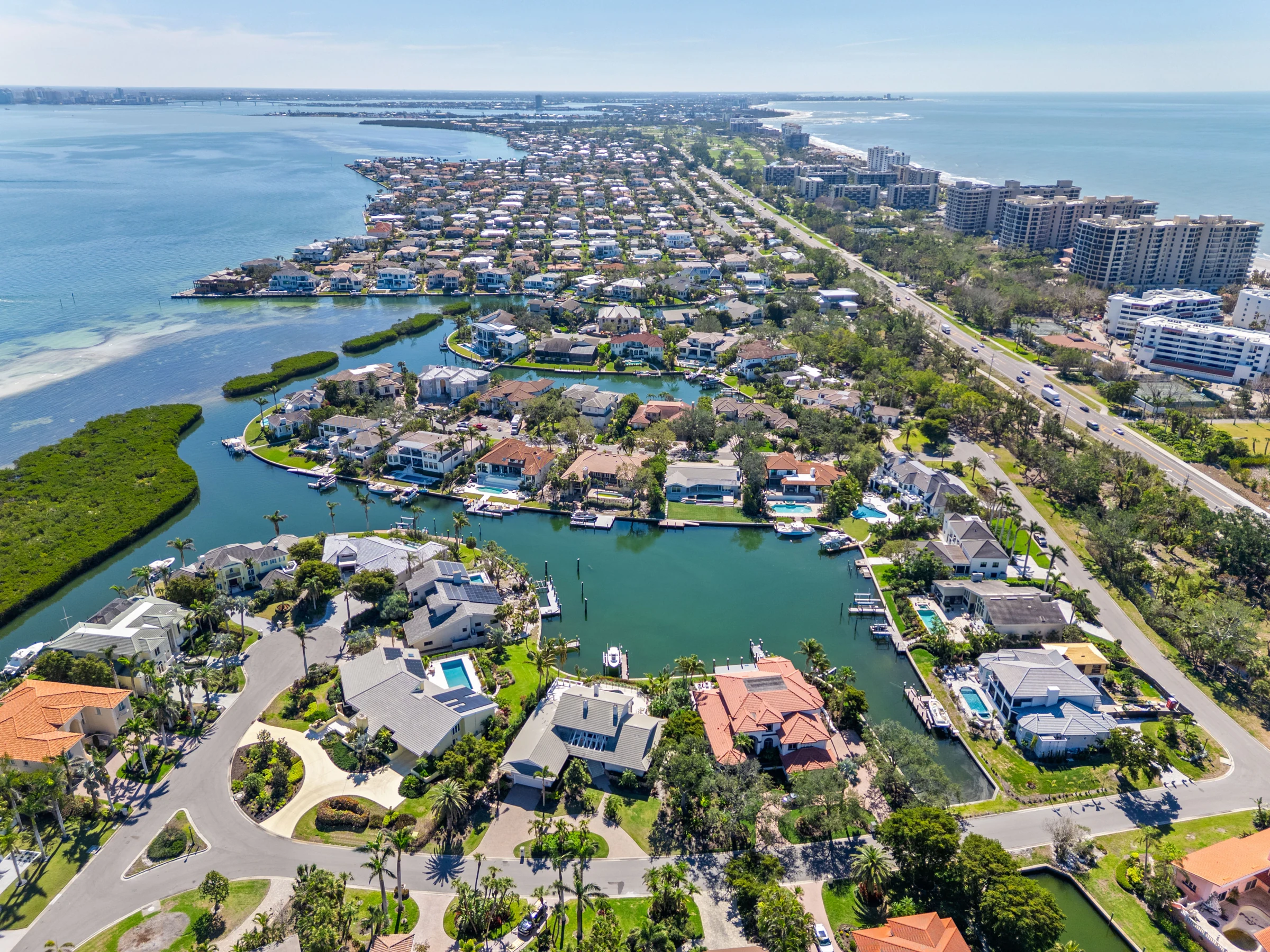 Coastal waterways and neighborhood from above photographed by Vuzario