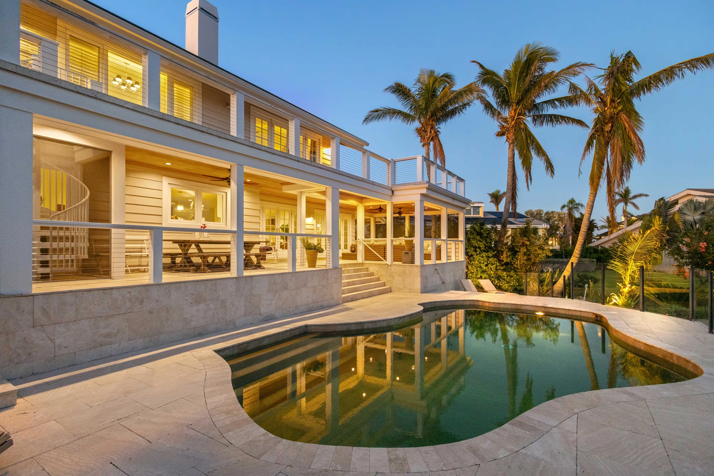 Warm evening light across the pool terrace photographed by Vuzario