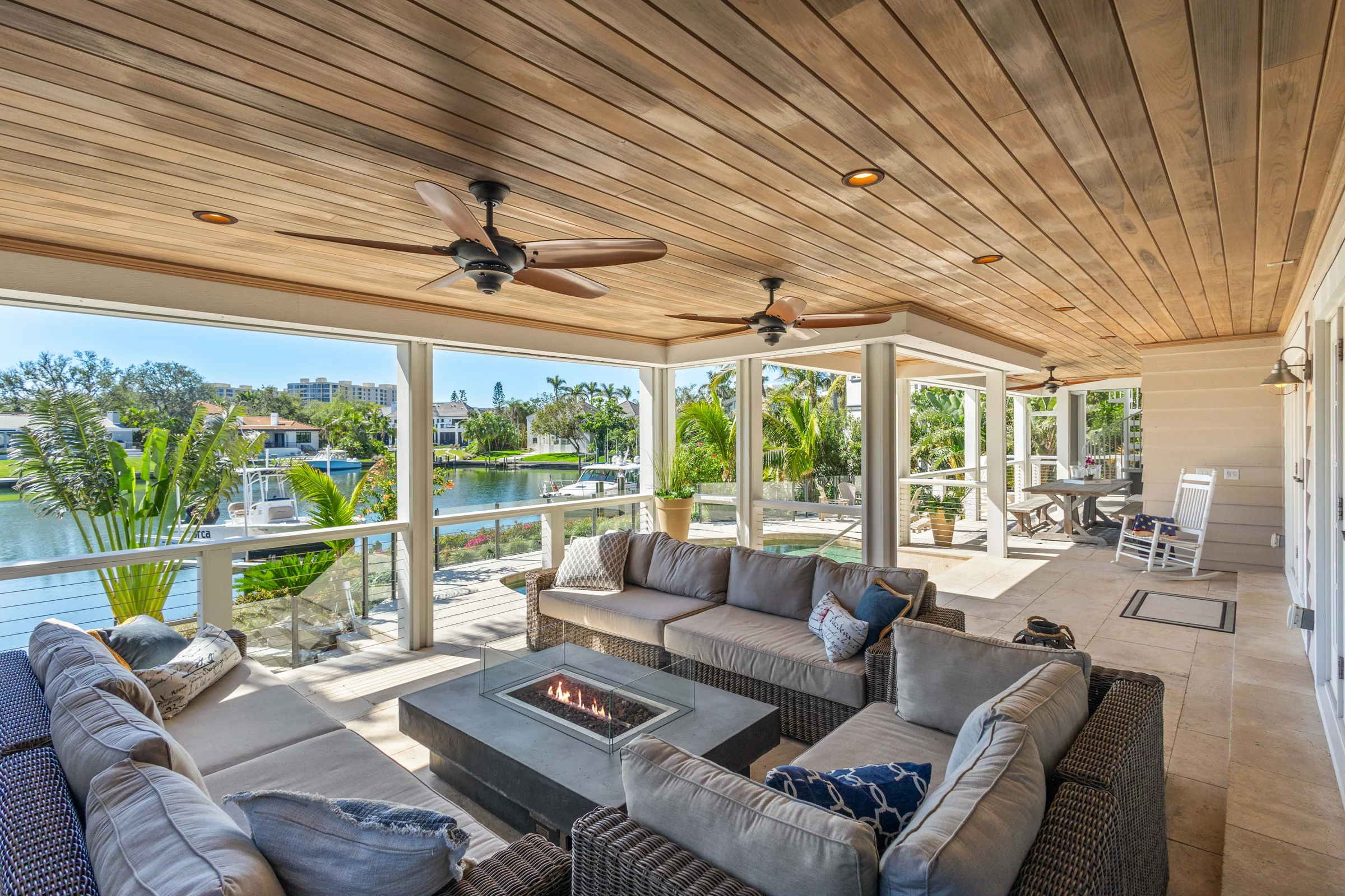 Covered waterfront outdoor living photographed by Vuzario