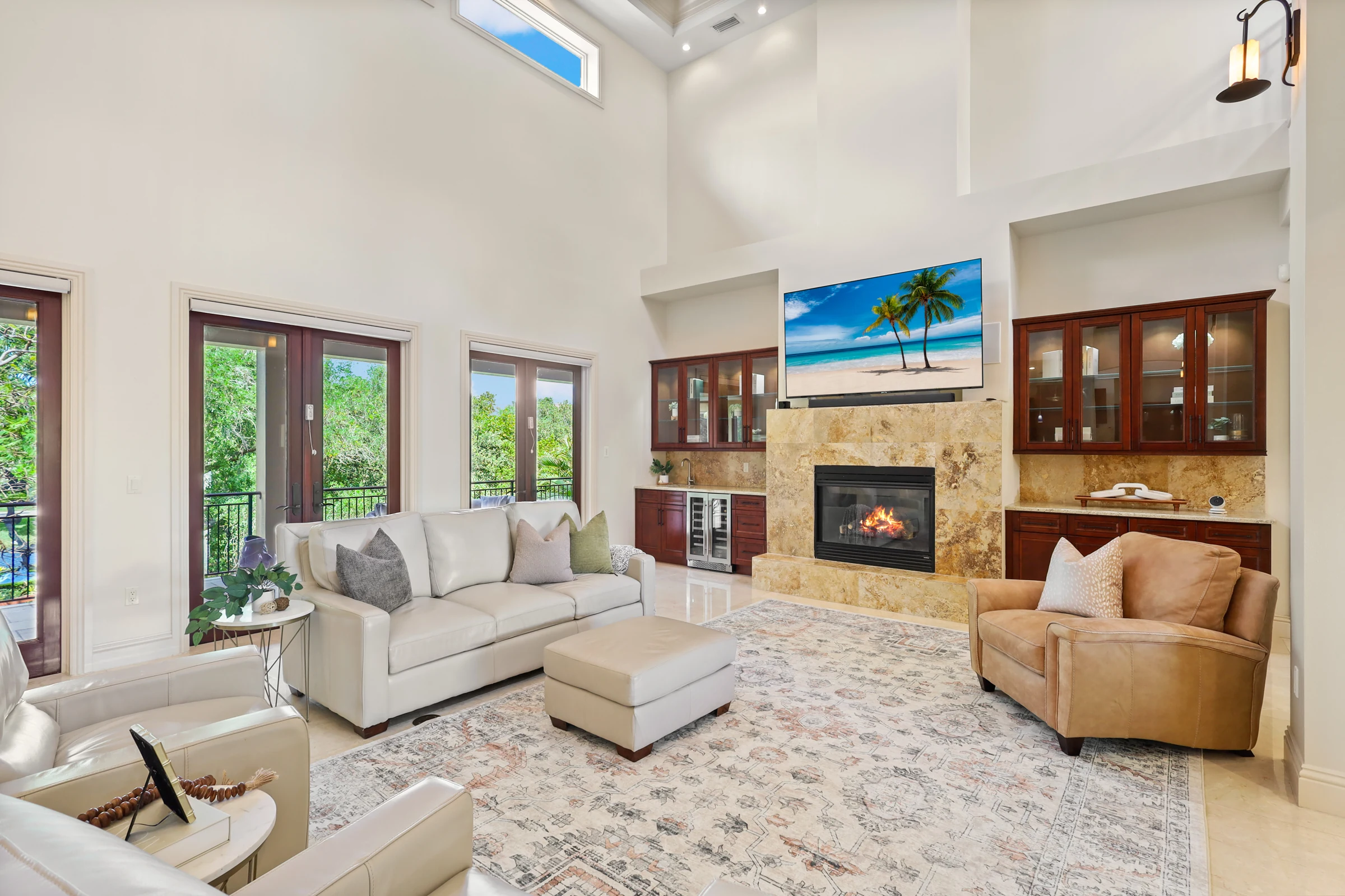 Two-story living room and fireplace photographed by Vuzario