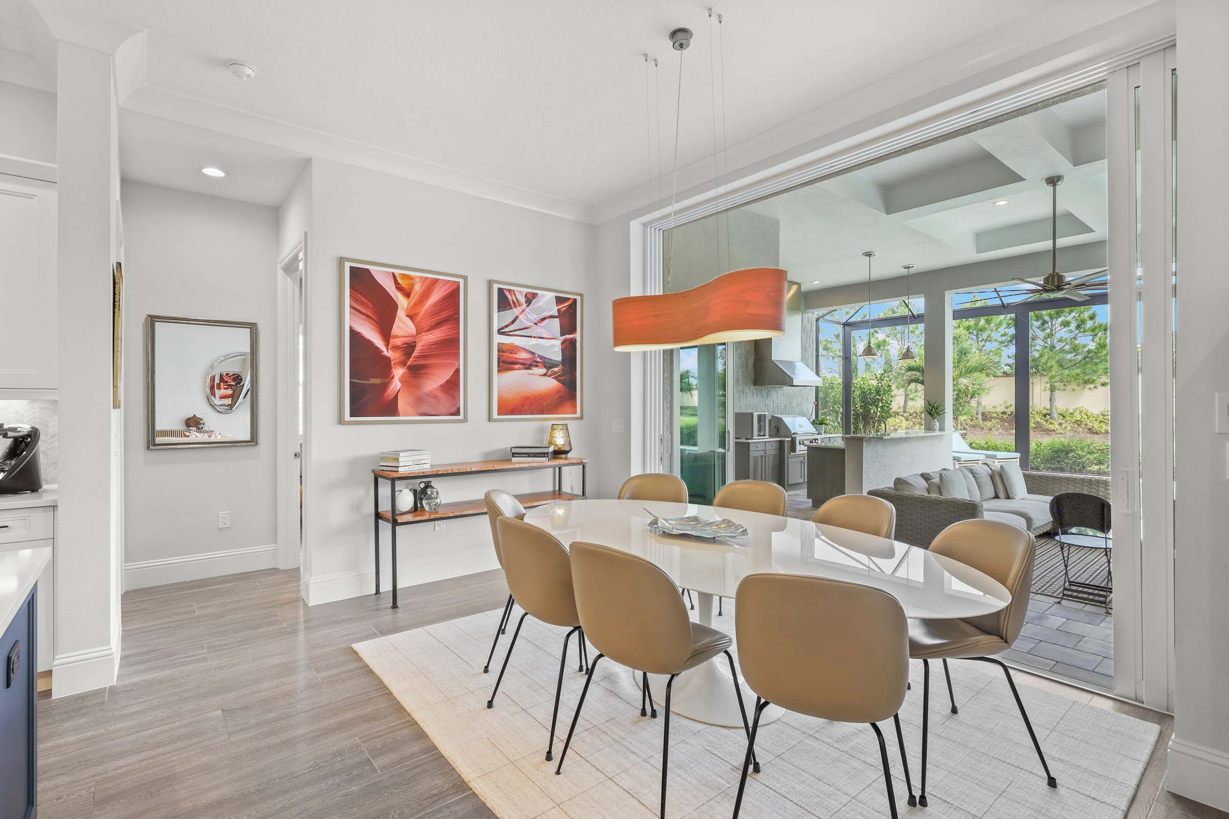 Contemporary dining room with pool views photographed by Vuzario