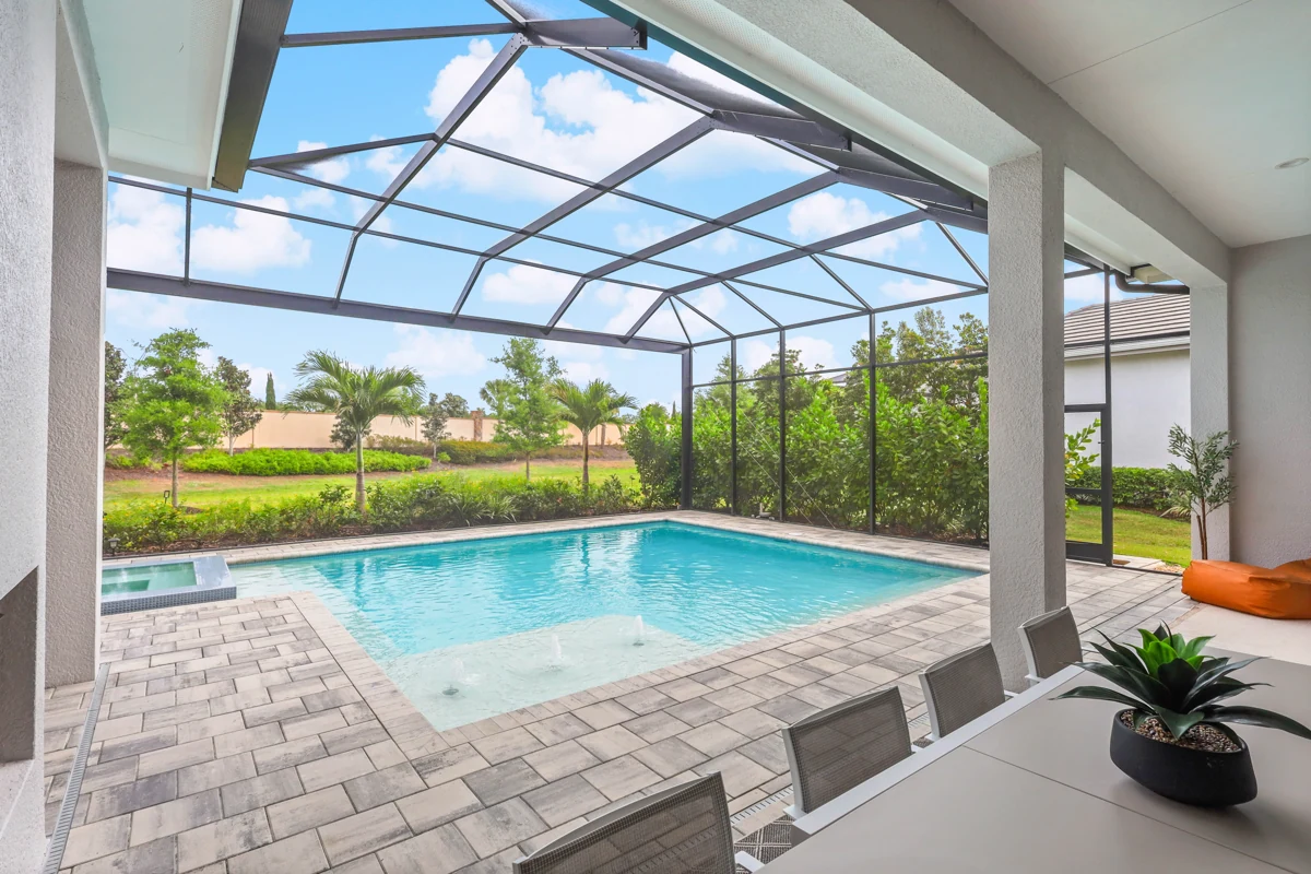 Sunlit pool and garden outlook photographed by Vuzario
