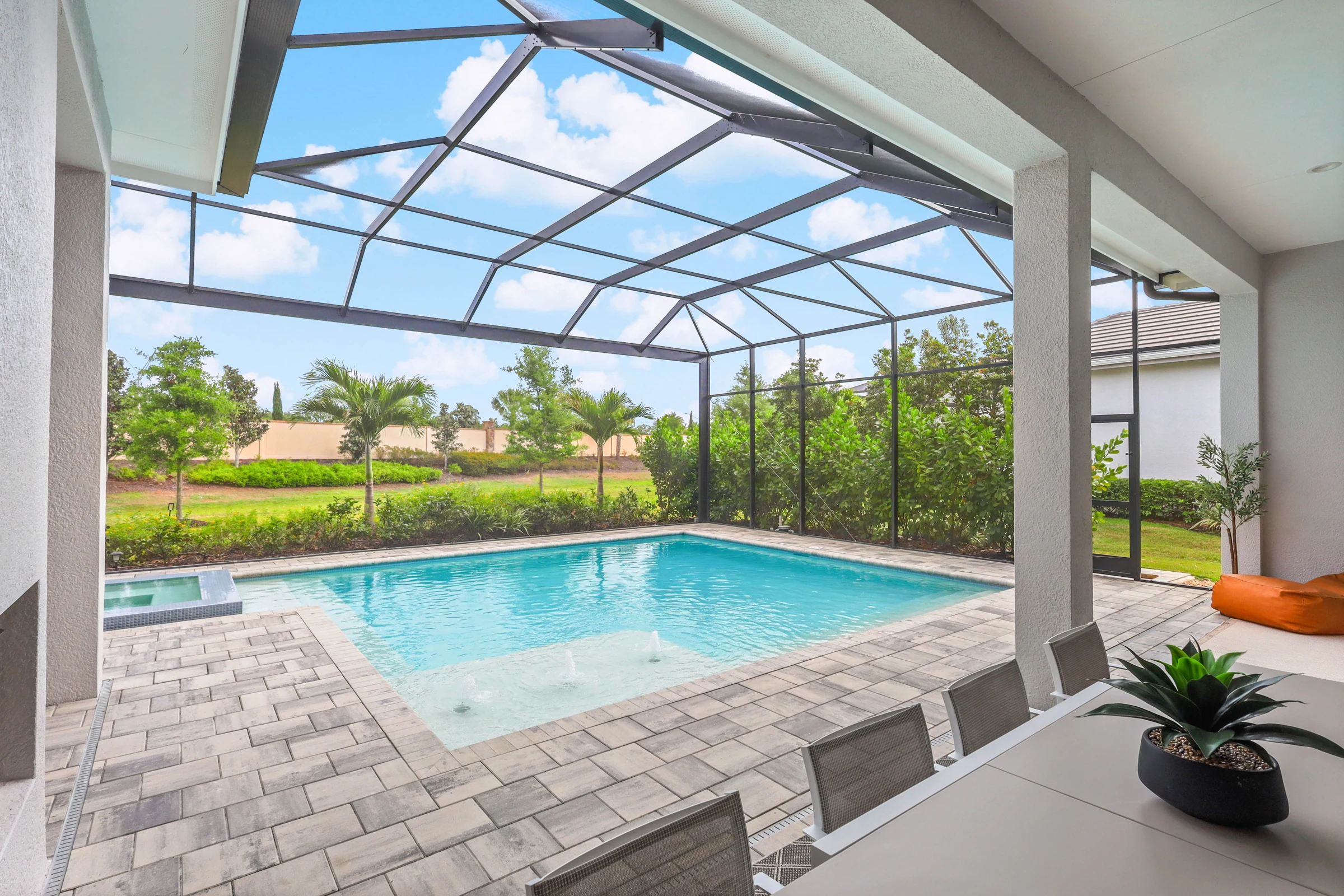 Sunlit pool and garden outlook photographed by Vuzario