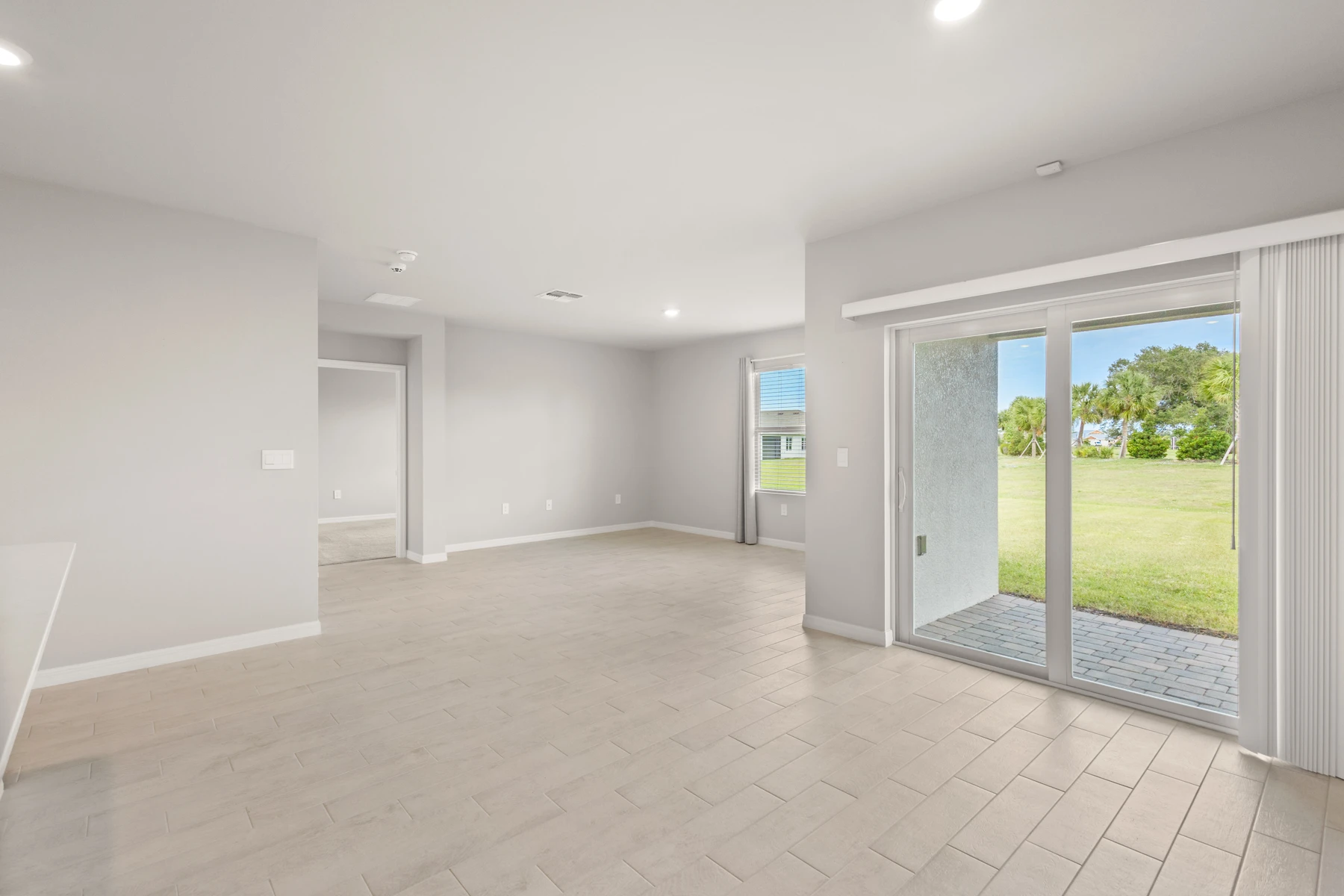 Unstaged living and dining room